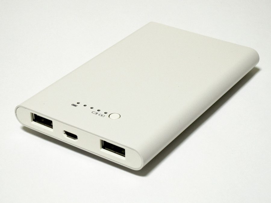 A slim white rechargeable power bank for smartphones