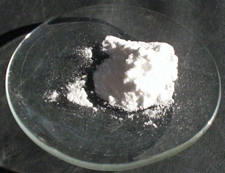 White lithium carbonate powder on a glass dish